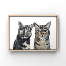 Load image into Gallery viewer, Framed painting of two cats. Both cats have short multi-coloured hair with bright green eyes.