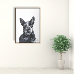 Framed painting of a dog portrait. Dog is looking at the viewer with black and white short hair and tall, pointy ears.